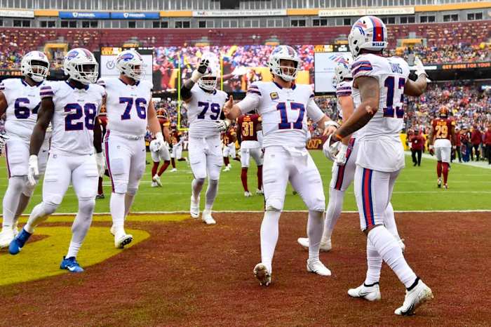 The Buffalo Bills celebrate after scoring a touchdown against the Washington Commanders.